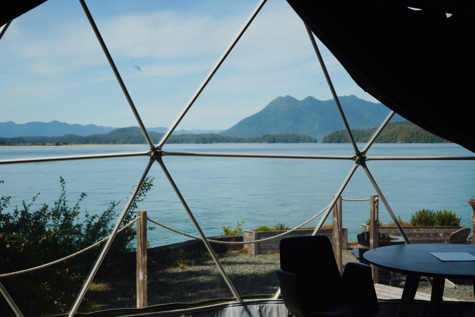 View of the water and mountains through a Wildpods dome window